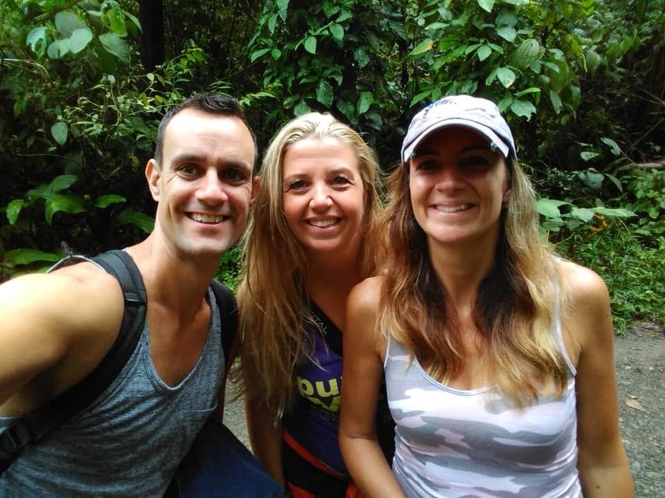 Travis with retreat leaders smiling together in the jungle