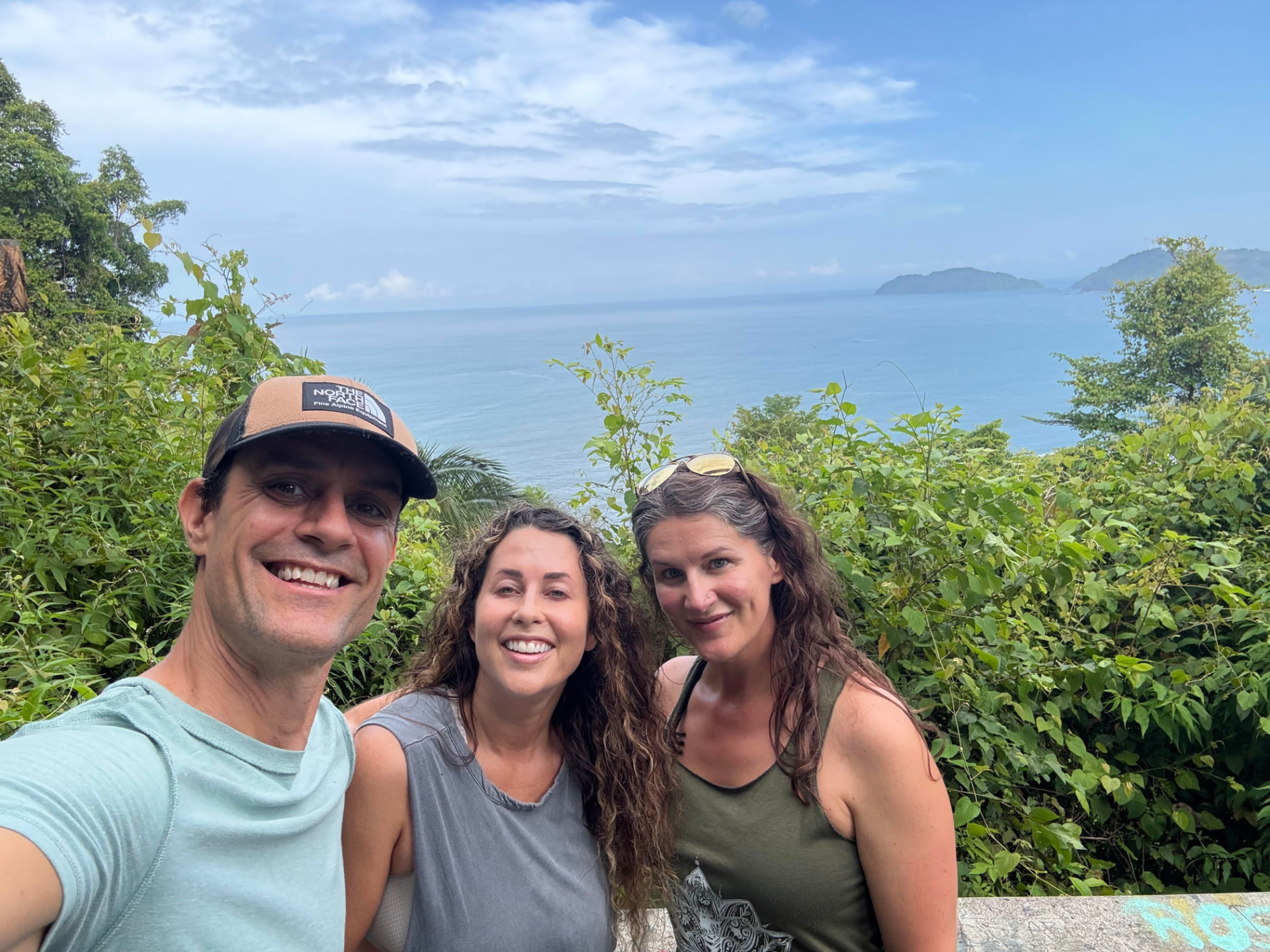 Retreat leaders smiling together with an ocean view