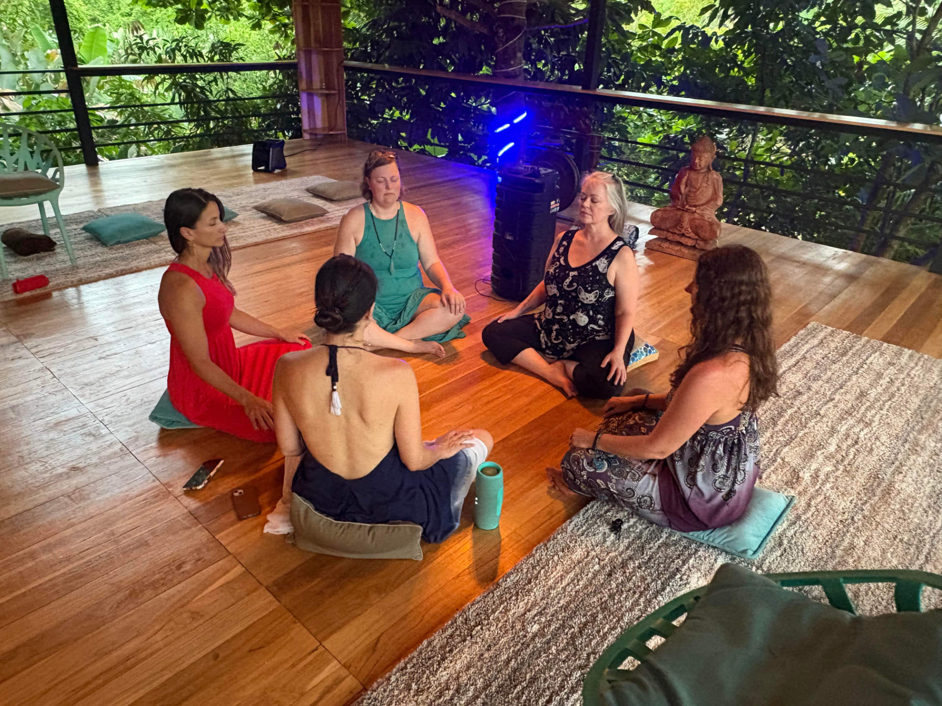 Cohort of retreat leaders in a guided meditation circle