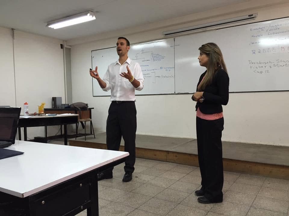 Travis Richardson teaching and speaking to a room during an international workshop